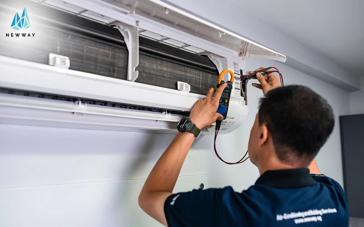 Technician performing air conditioning diagnosis in singapore