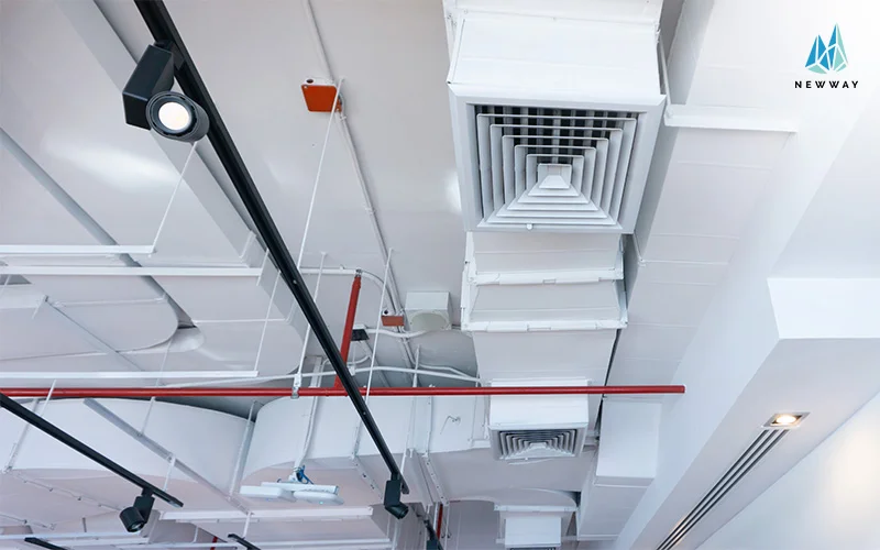Exposed ceiling with air ducts, vents, lights, and sprinkler pipes
