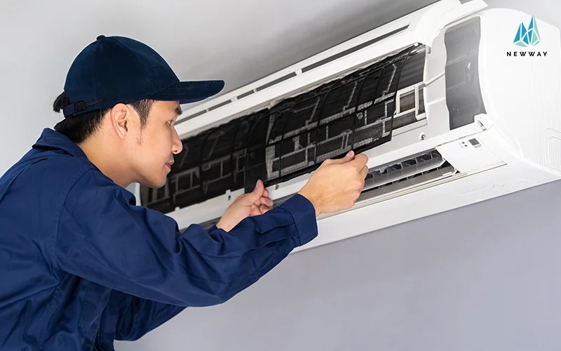 Technician checking aircon filter
