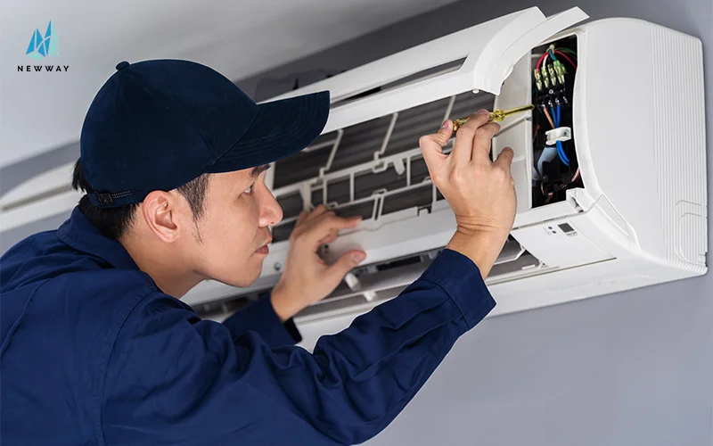 A man during aircon inspection to check air conditioner filters